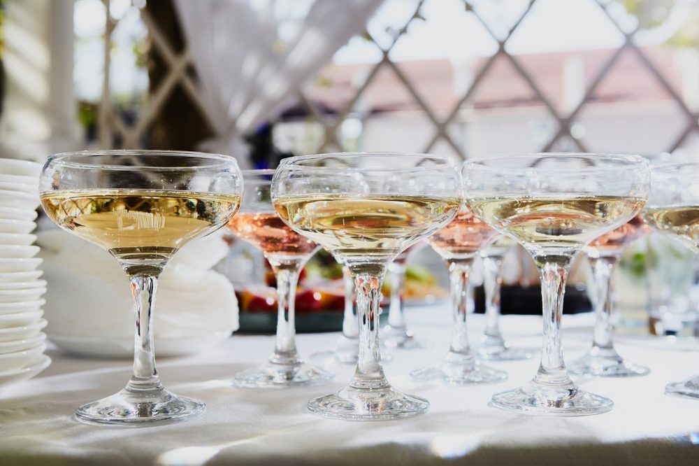 Coupes of champagne lined up for a cocktail hour